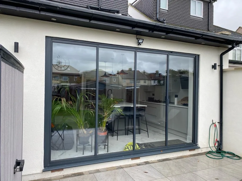 Anthracite grey patio doors (RAL 7016), with 4 panels