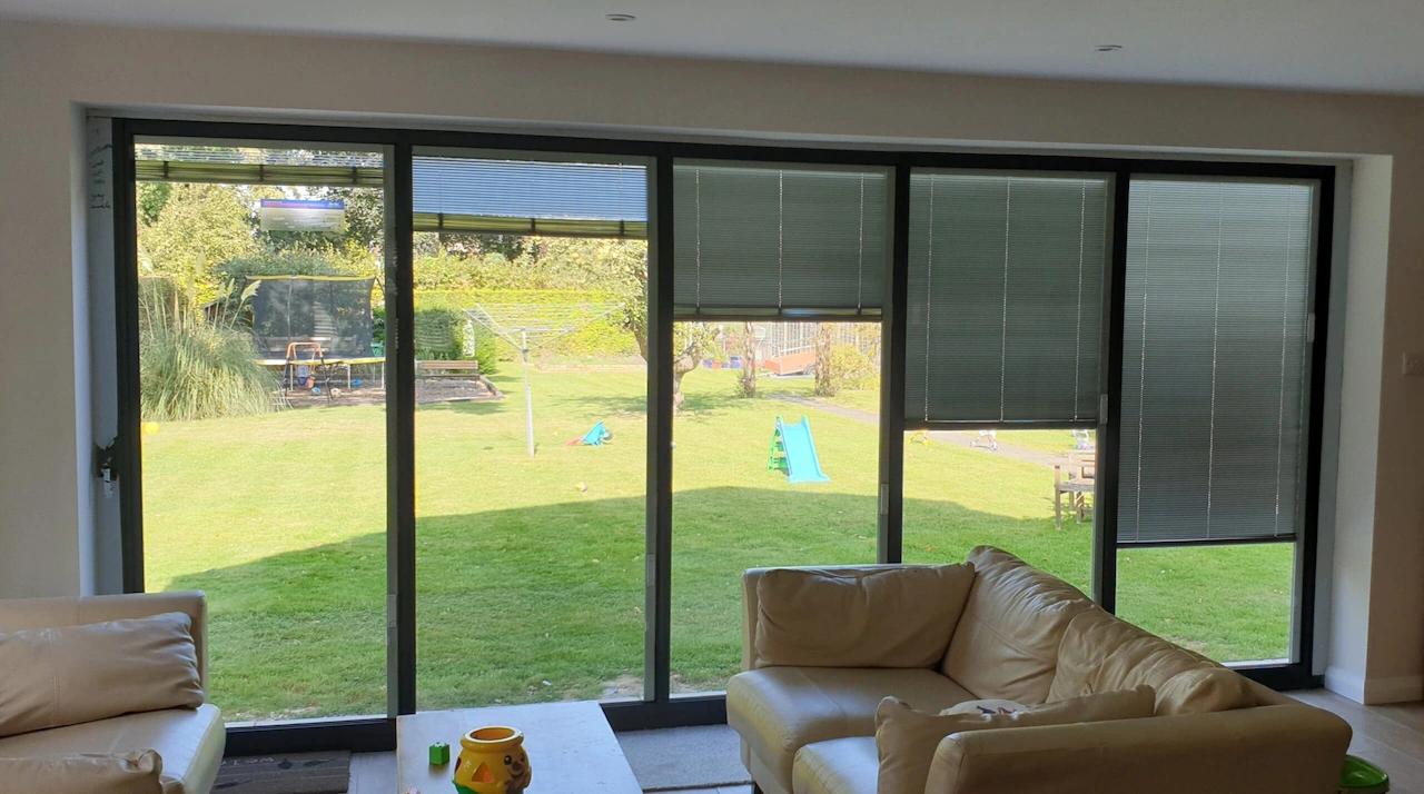 Bifold doors with integrated blinds, in various possible positions from closed to open