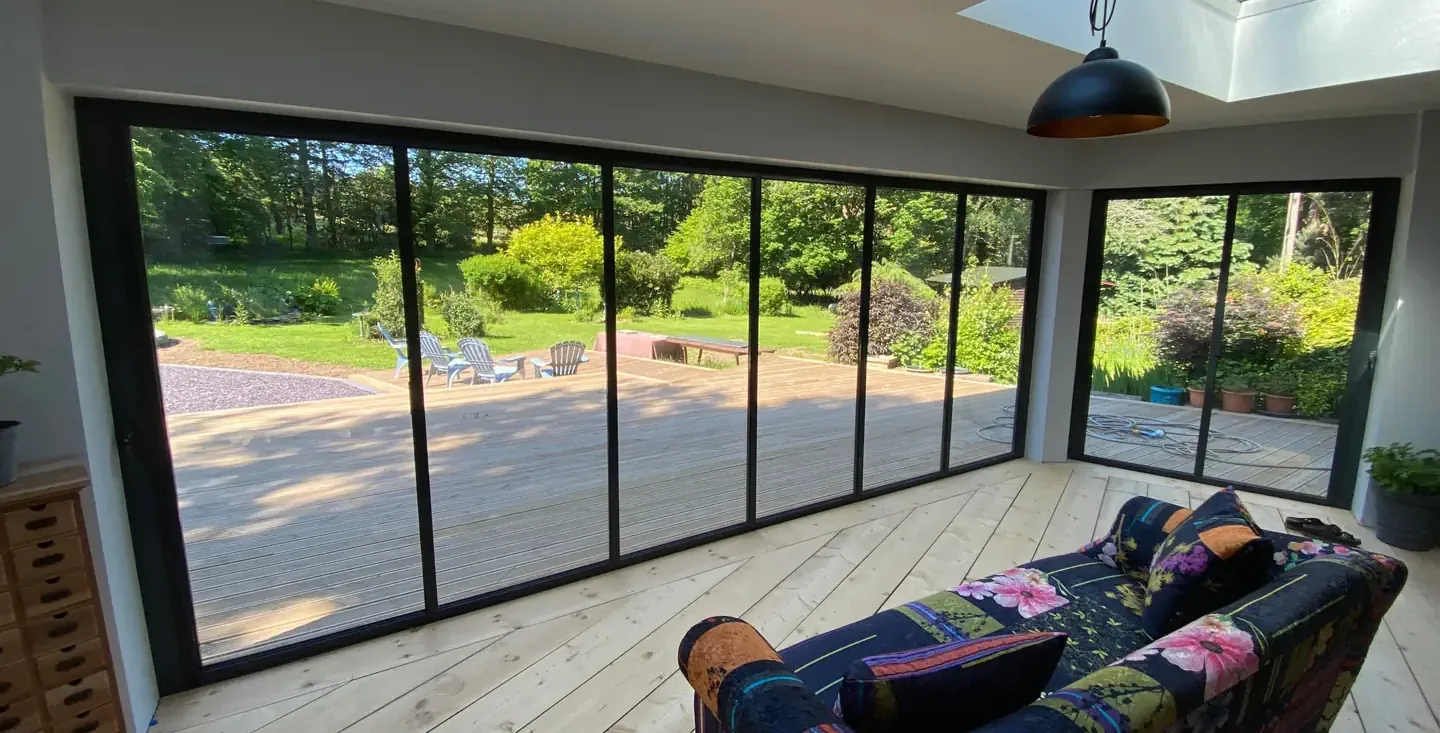 Living room with black bifolding doors