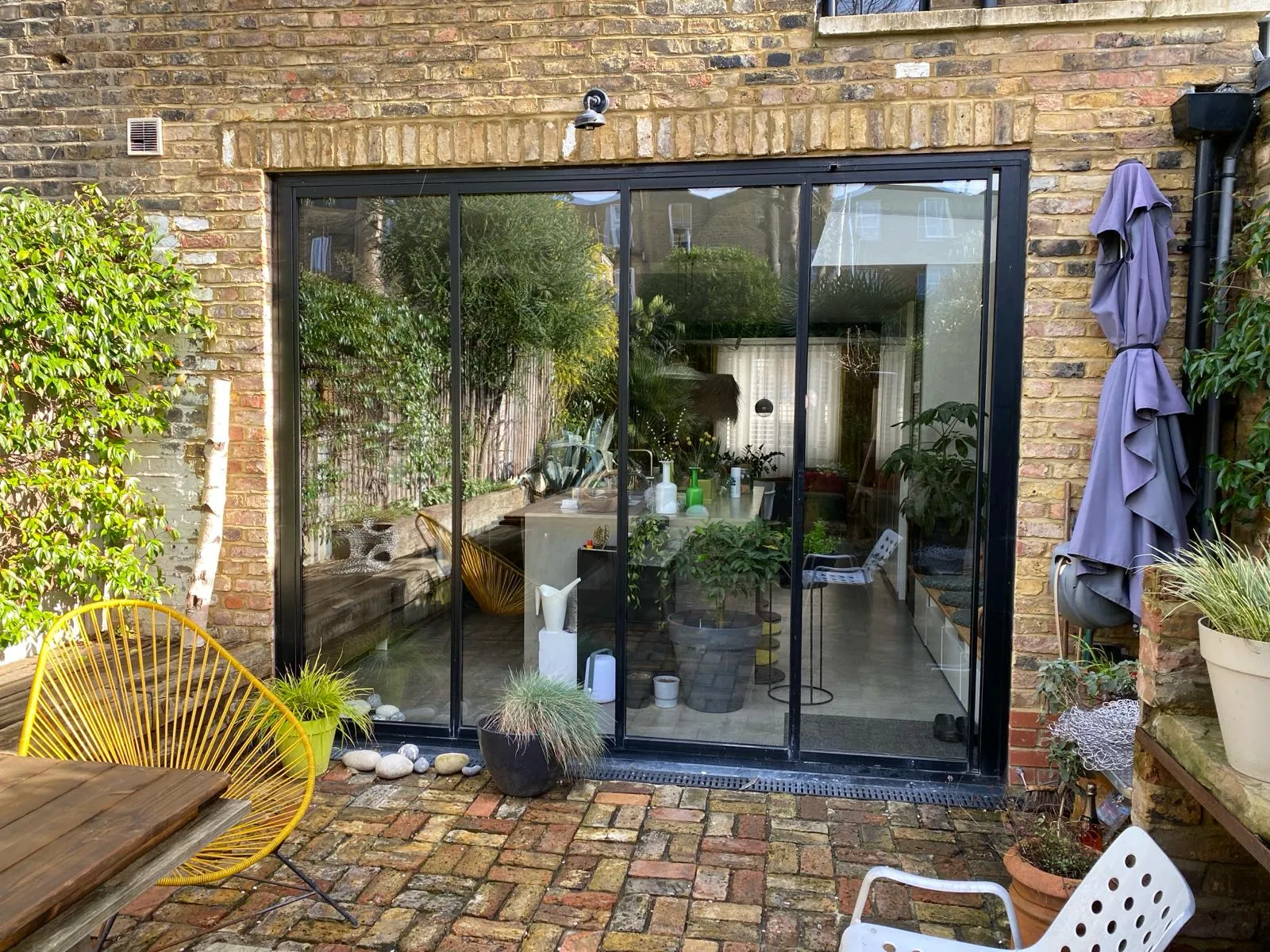 Black bifold patio doors, dining room extension