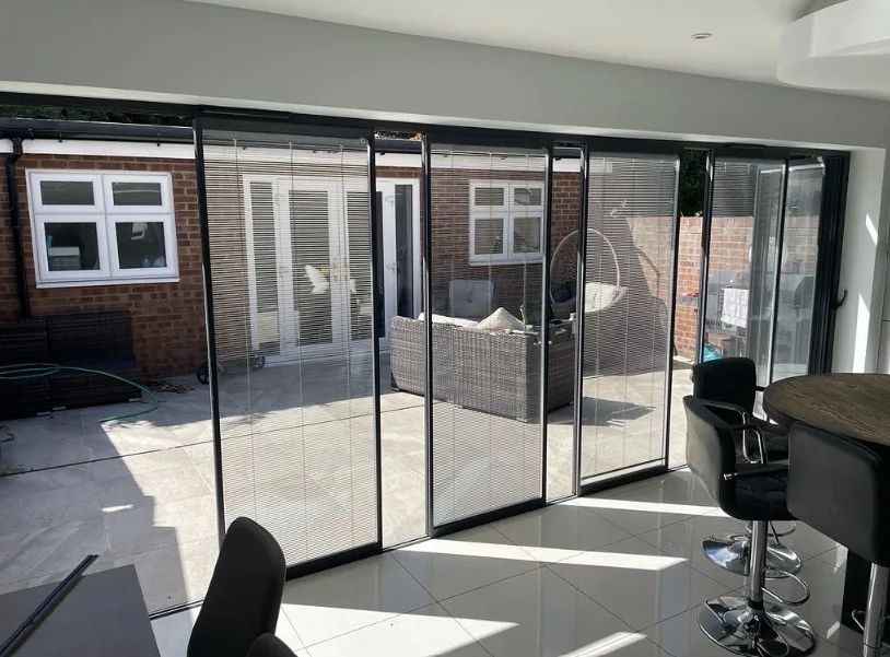 Slide and turn bifold doors with inbuilt blinds