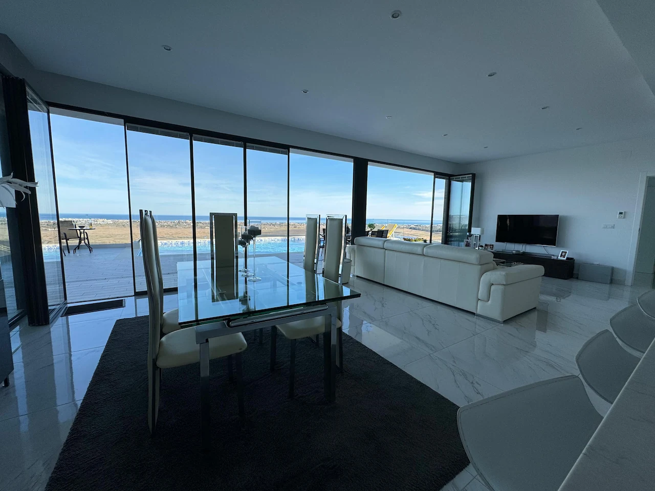 Large slim bifold doors beach view