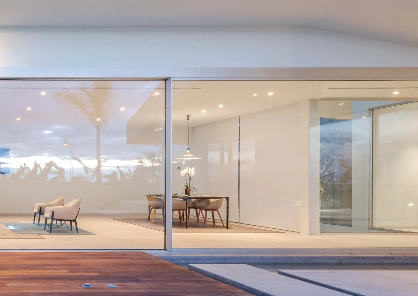 White slimline sliding doors in a living room area