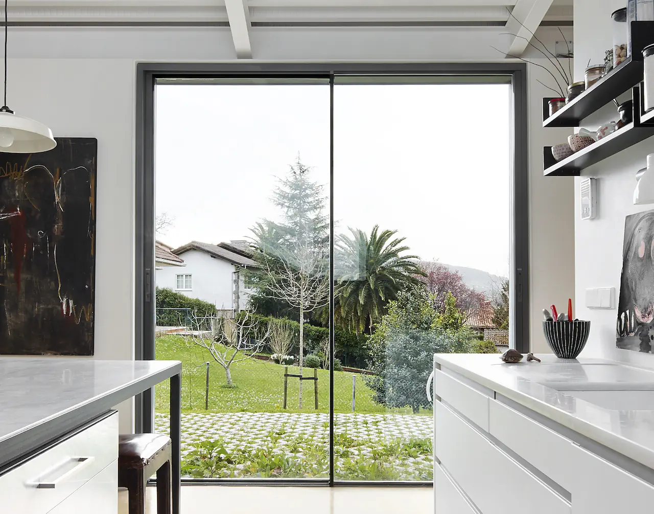 Kitchen with two pane aluminium sliding doors