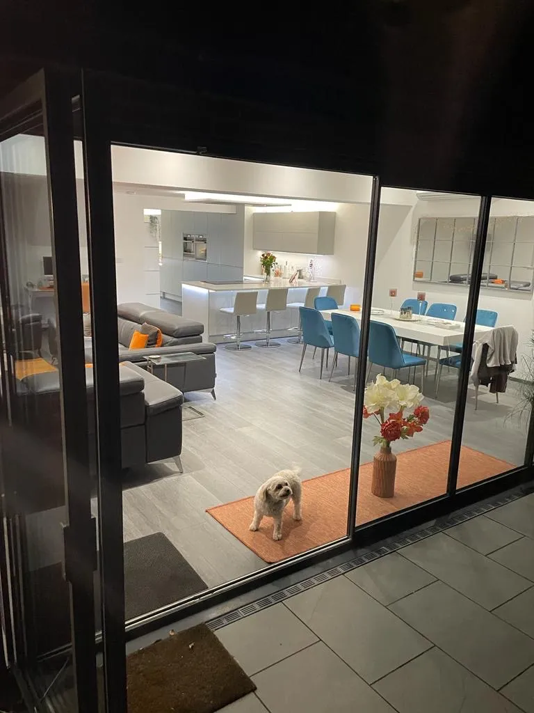 Open plan kitchen with internal bifold doors