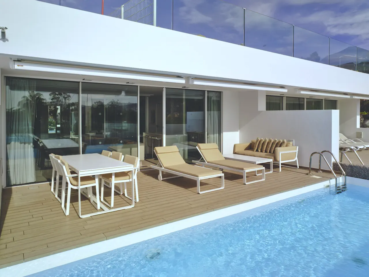 Slimline aluminium sliding patio doors by a pool