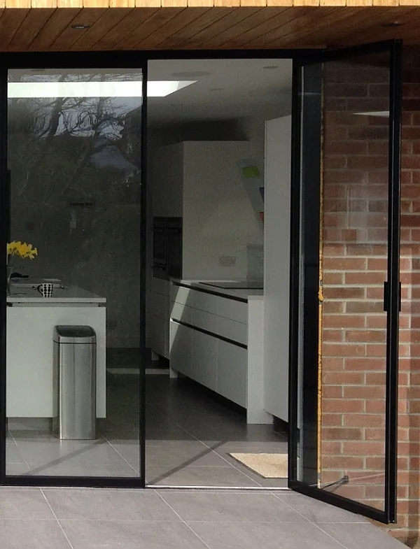 Black french doors, with one door open