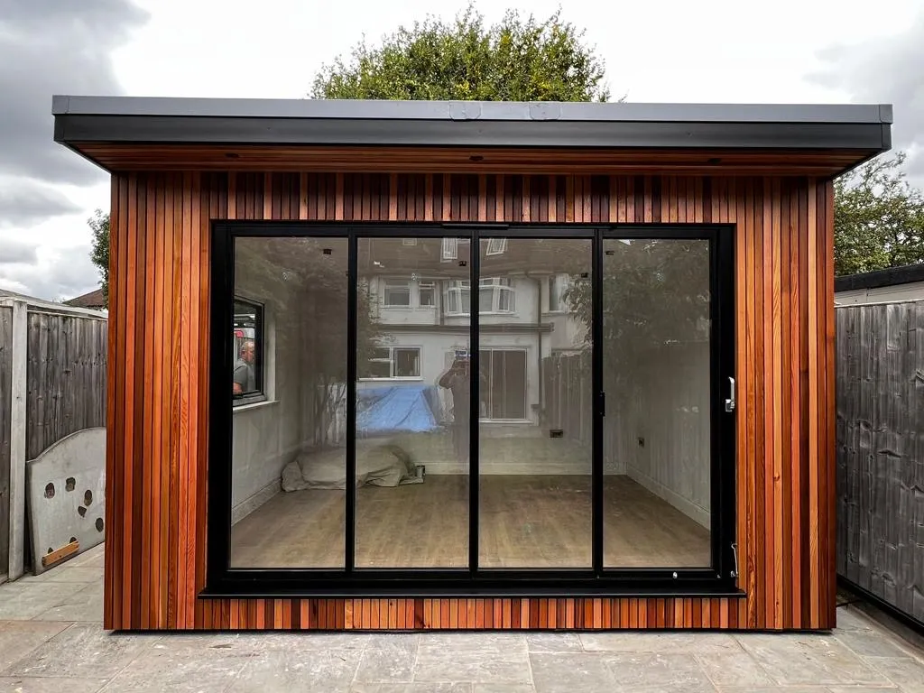 small garden room with bifold doors