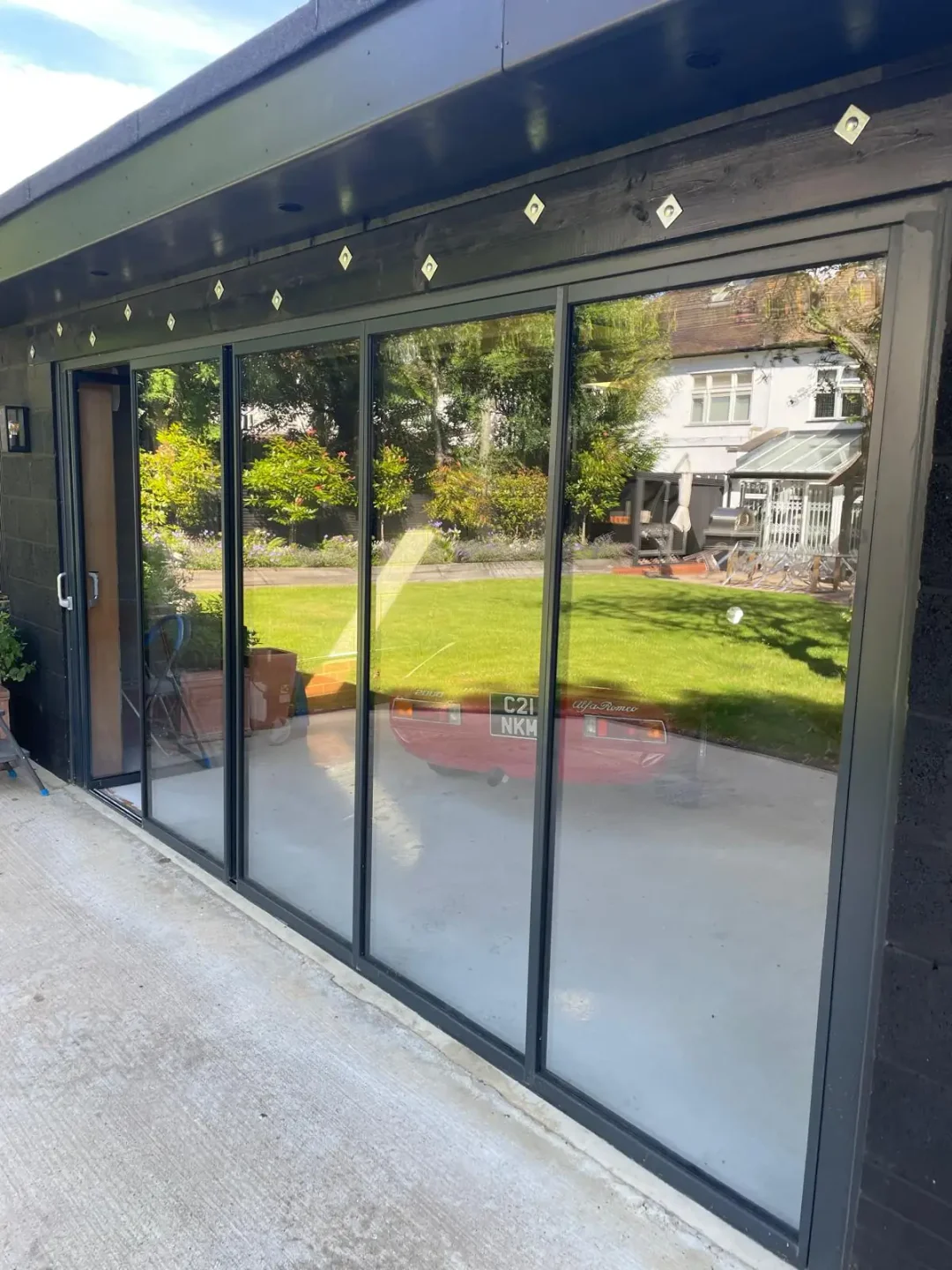 external aluminium bifold doors with traffic door