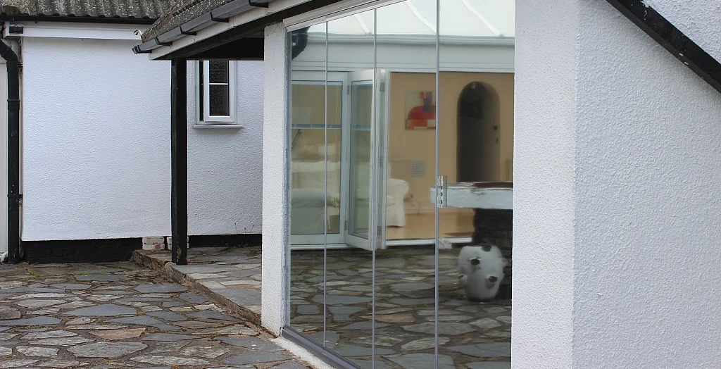 external frameless folding glass doors