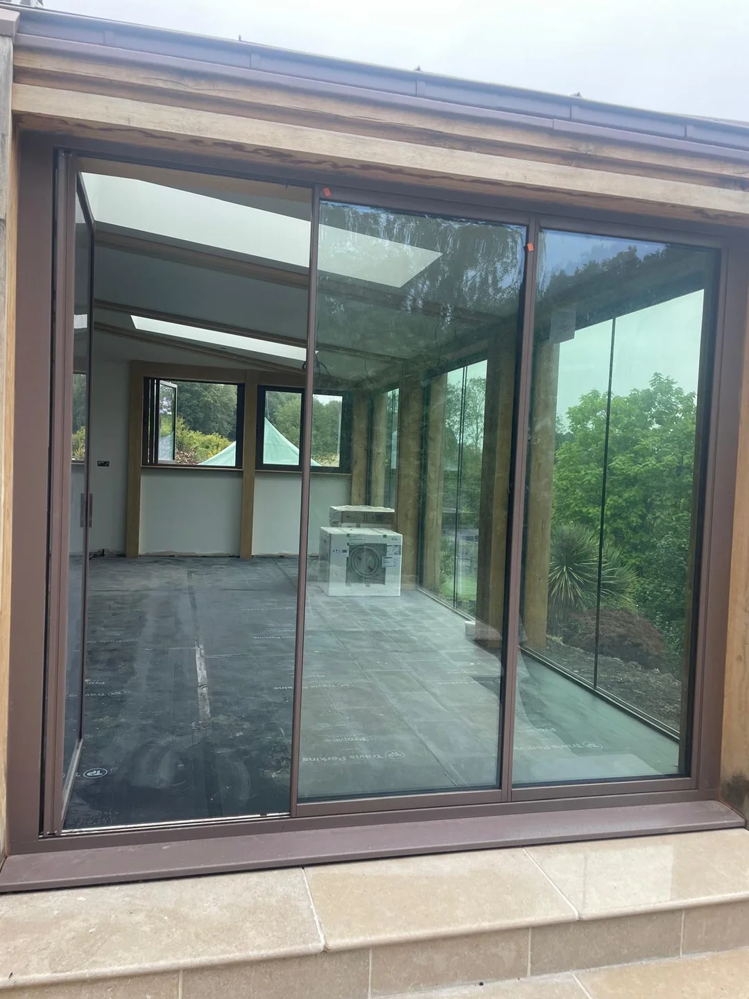 conservatory with brown bifold doors